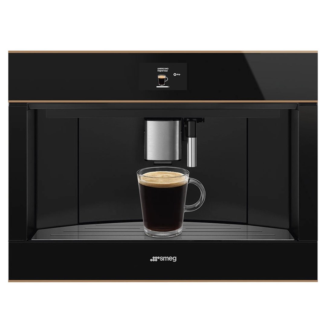 Built-in coffee machine dispensing coffee into a clear mug, with a screen display