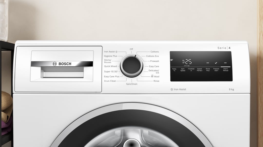 Close-up of a white Bosch washing machine control panel and dispenser