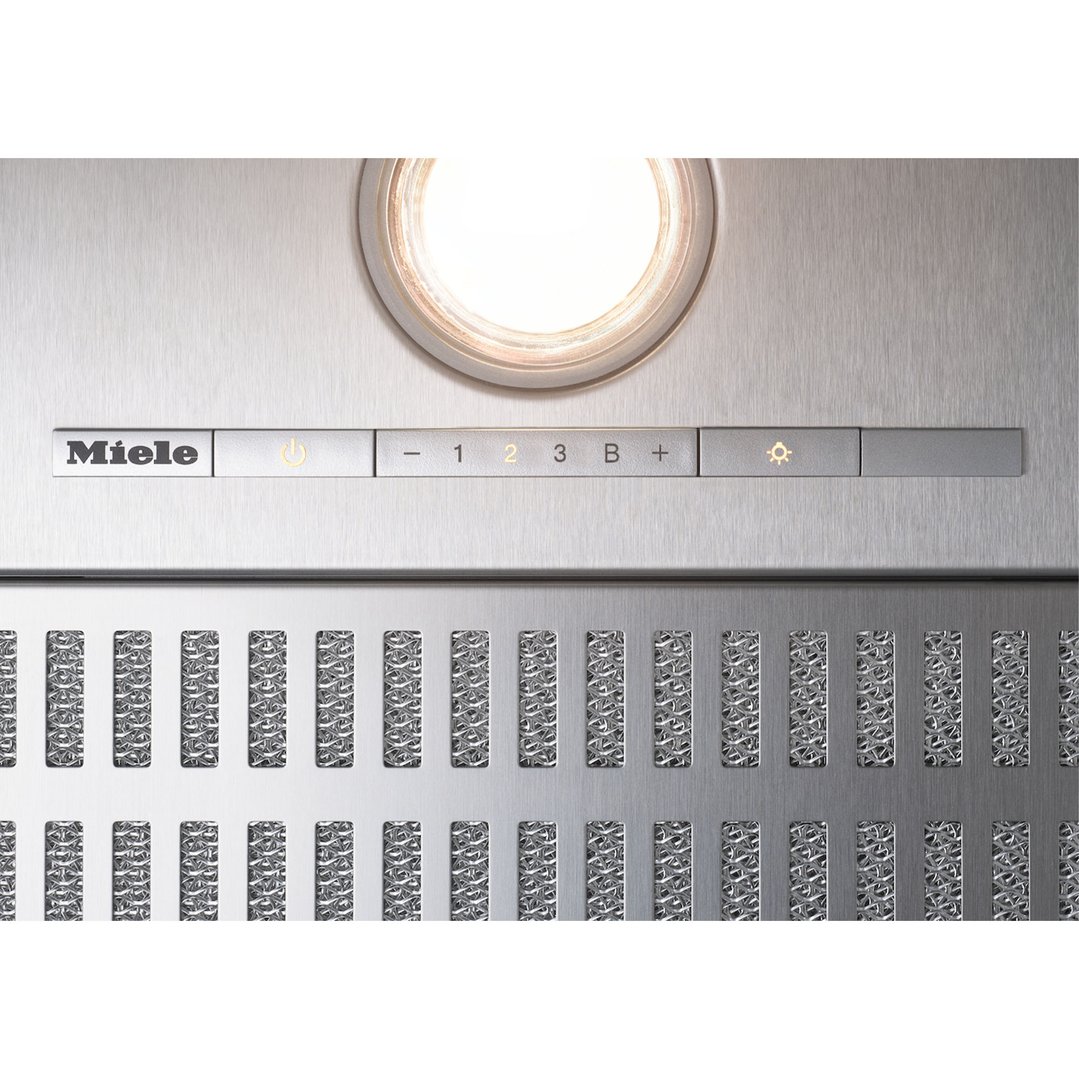 Close up of a Miele rangehood control panel and light