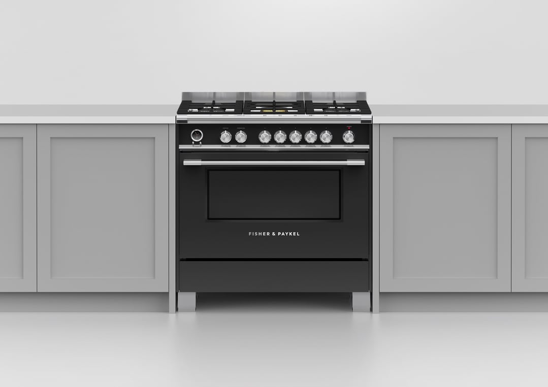 Black freestanding oven with gas cooktop in a kitchen setting
