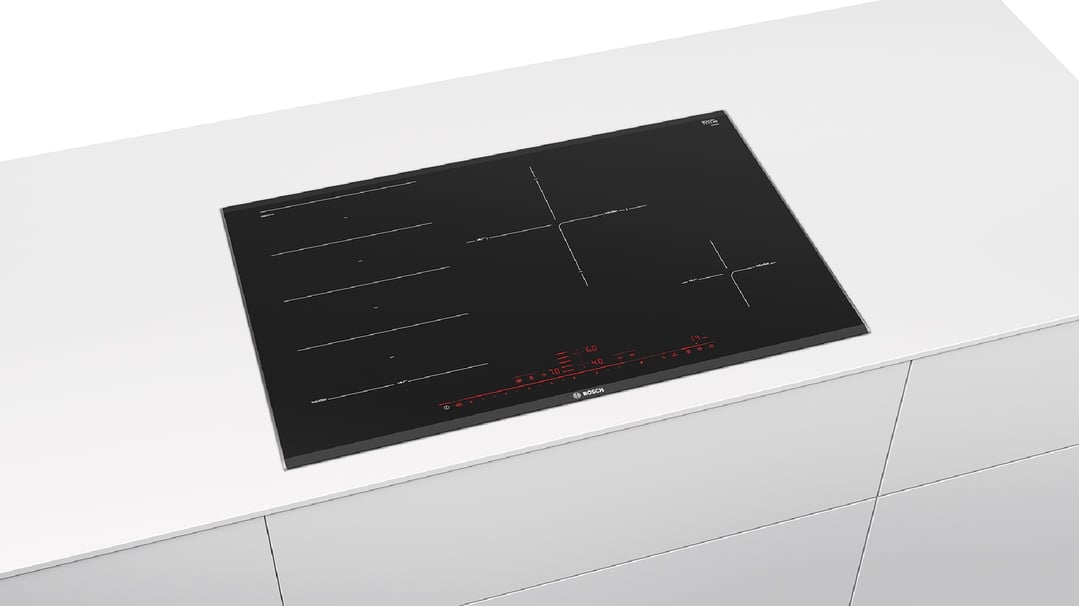 Black Bosch induction cooktop built into a white kitchen countertop