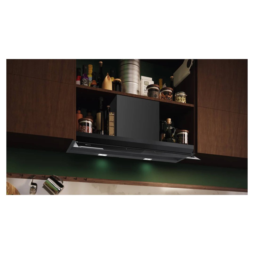 Black integrated rangehood with lights installed under a kitchen cabinet