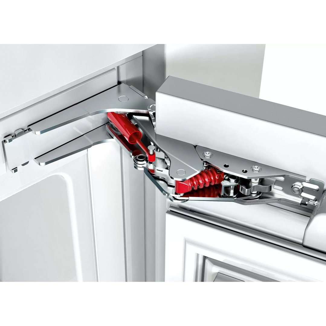 Close-up of the hinge mechanism of a built-in freezer door