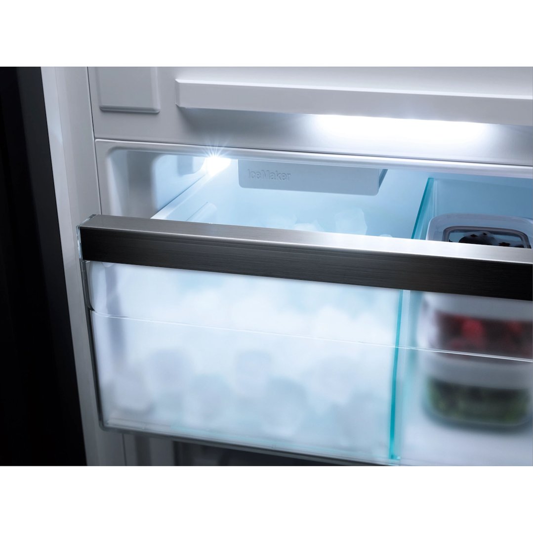 Close up of the interior of a fridge freezer with an ice maker