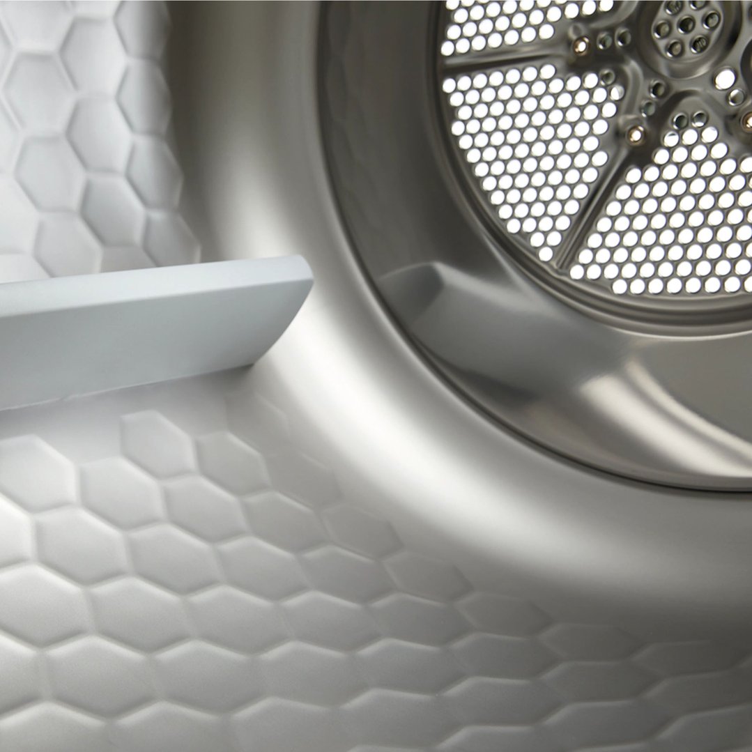 Close up of the interior of a dryer drum with honeycomb texture