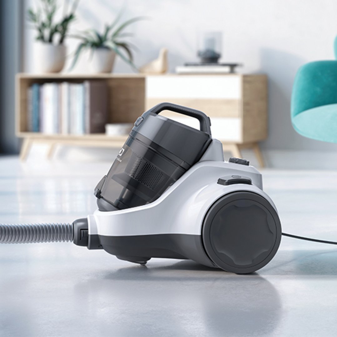 White and grey vacuum cleaner on a light floor in a living room