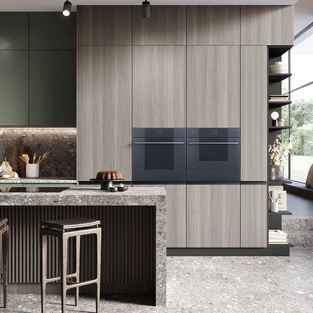Two built-in microwaves in a modern kitchen with a cake on the counter