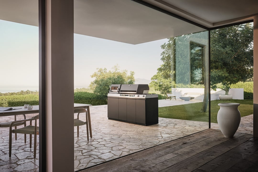 Outdoor kitchen BBQ on a patio with a view of the ocean