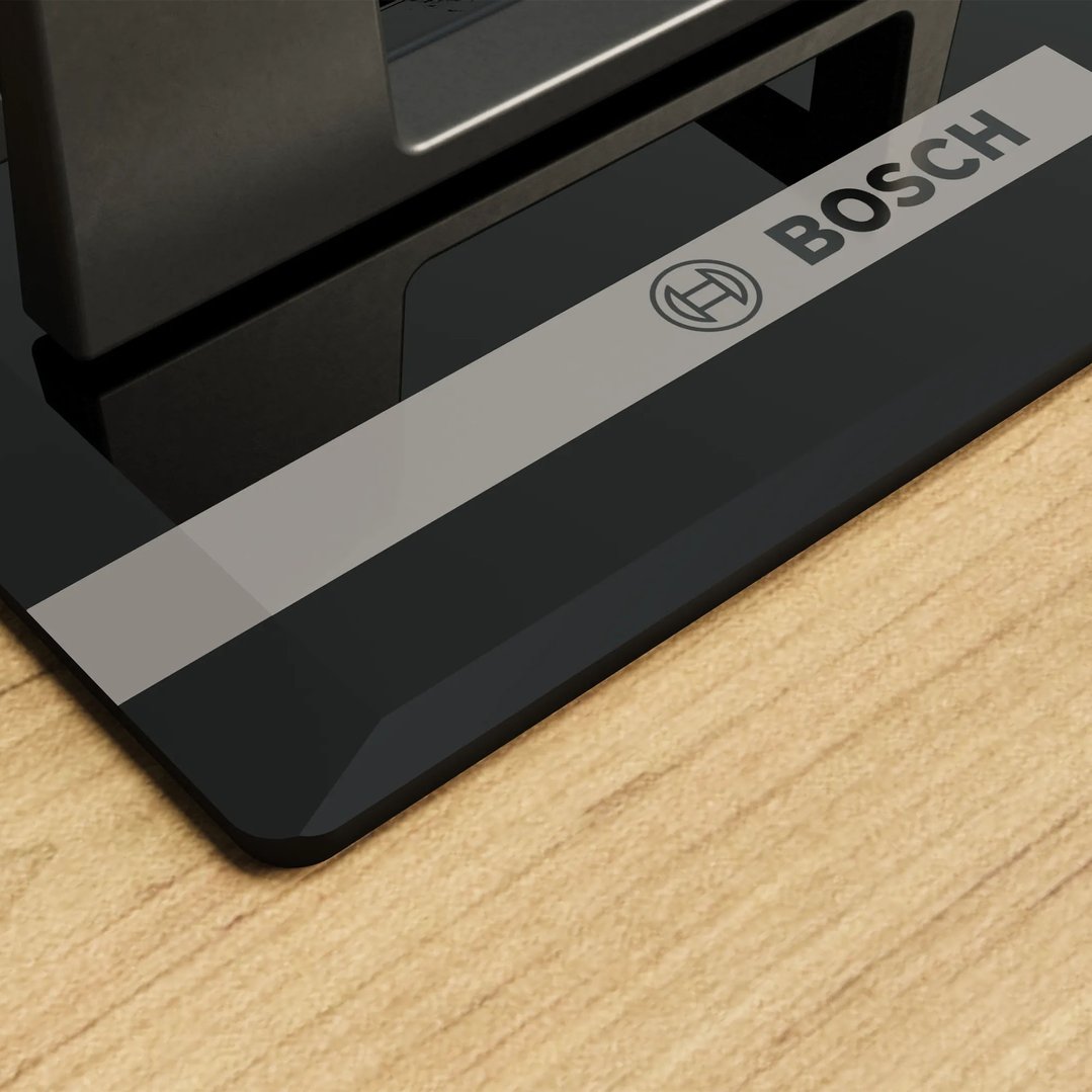 Close up of a Bosch cooktop on a wooden countertop