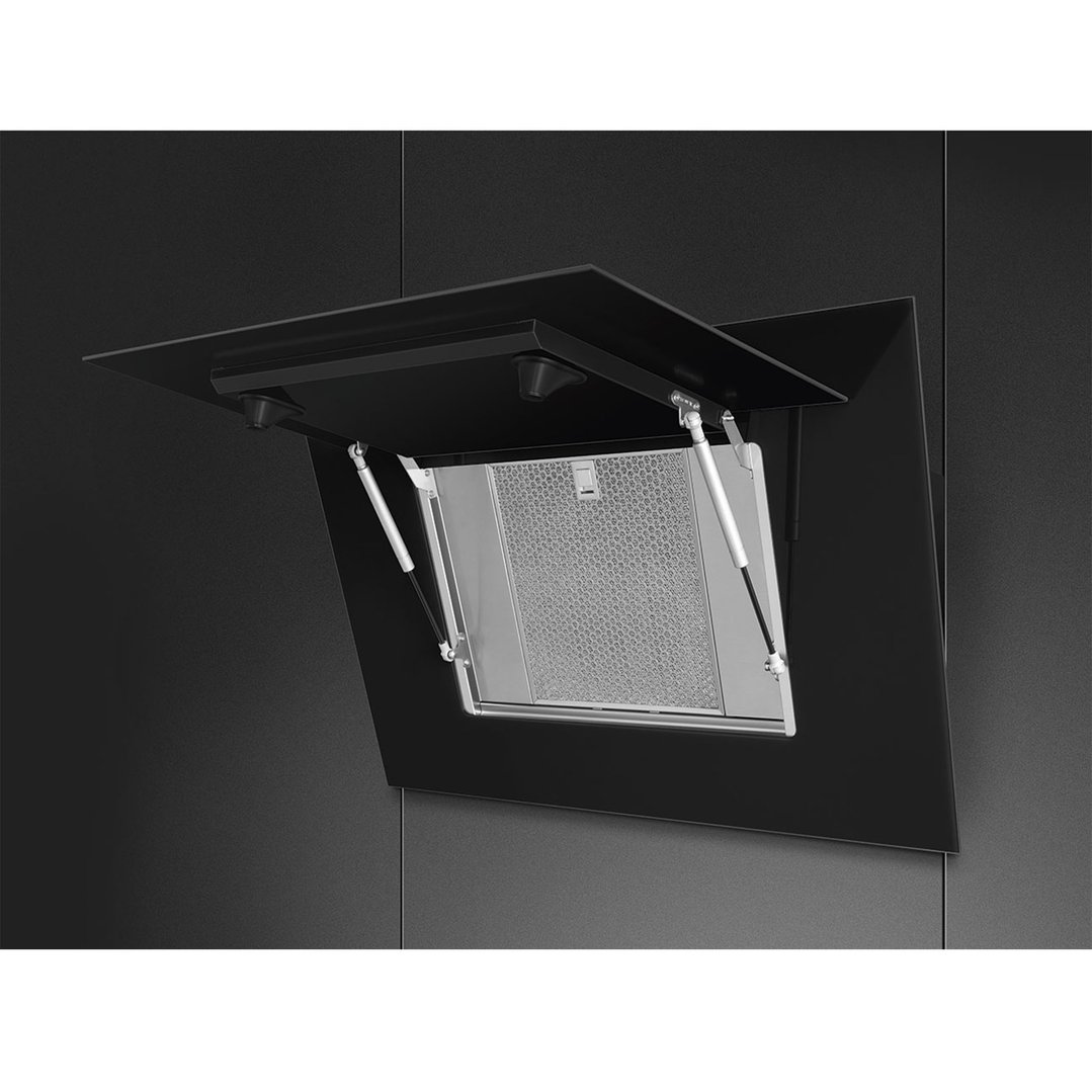 Black vertical rangehood with the filter panel open in a dark kitchen