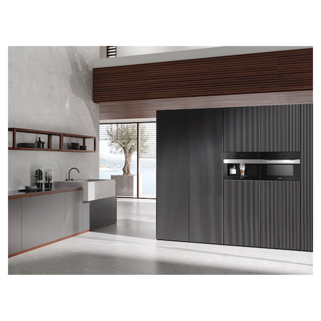 Built-in coffee machine in a modern kitchen with a view of the sea