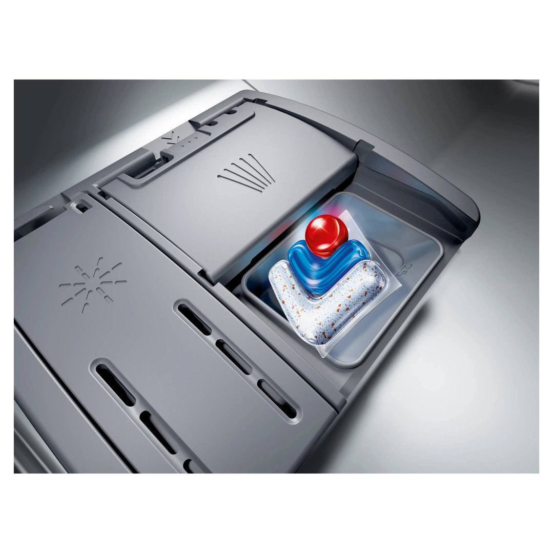 Dishwasher detergent tablet in the dispenser of a dishwasher