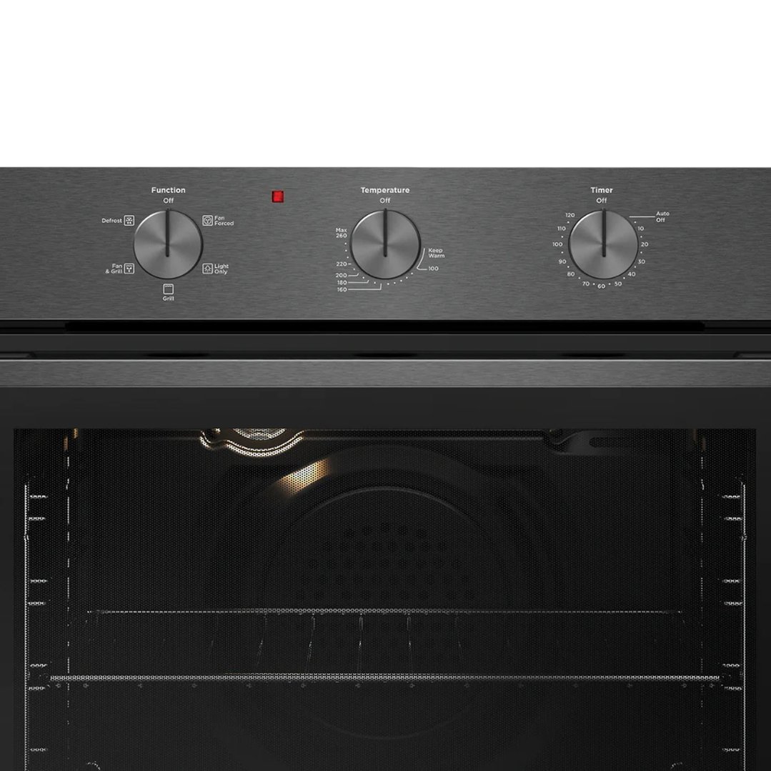 Close-up of a dark grey oven with control knobs and an open door