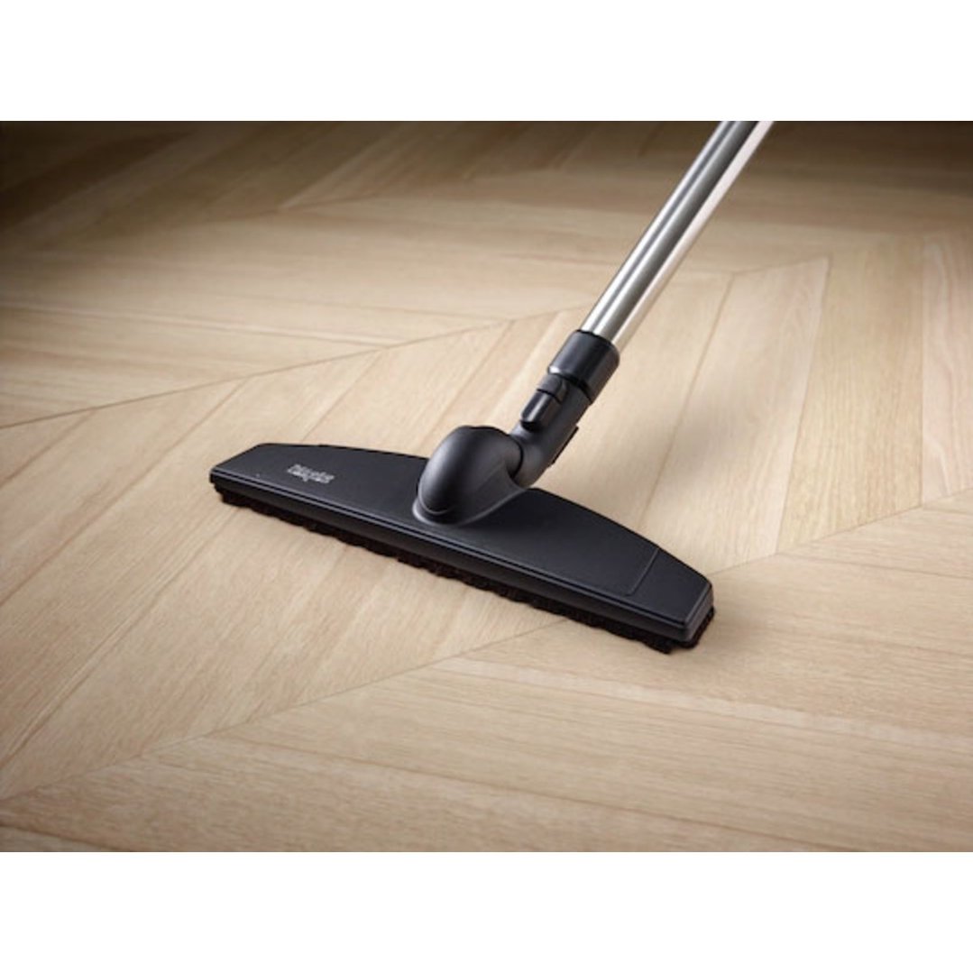 Vacuum cleaner parquet twister XL floorbrush on a light wooden floor