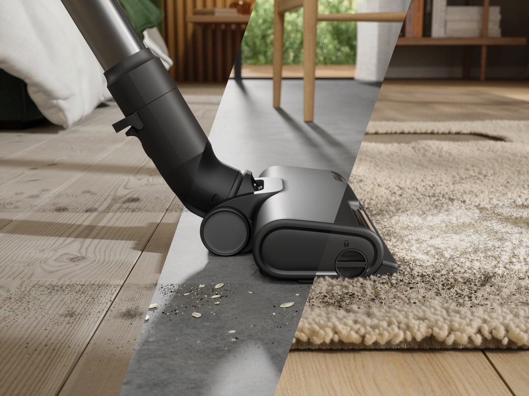Cordless vacuum cleaner head cleaning dirt from hard floor and carpet