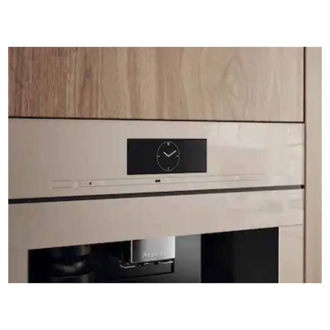 Built-in coffee machine with a clock display, integrated into a wooden cabinet