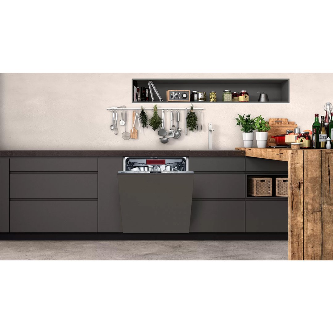 Fully integrated dishwasher with door ajar in a modern kitchen setting