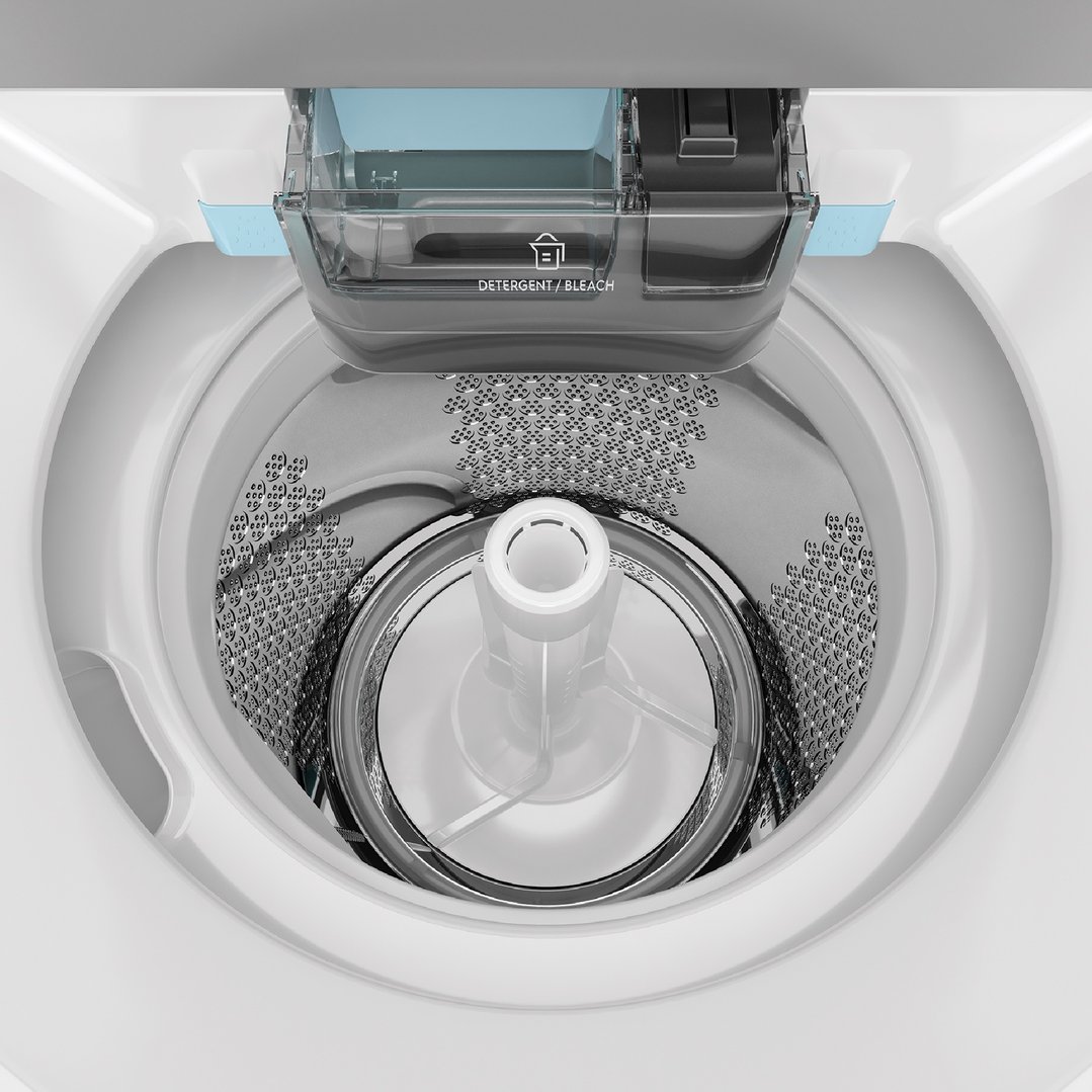 Top-down view of a washing machine drum with agitator and detergent dispenser