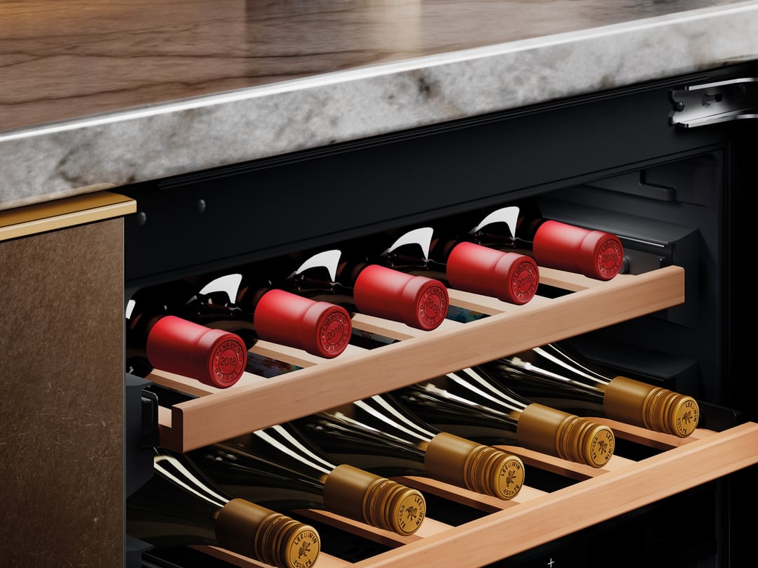 Close up of a wine cabinet filled with red and white wine bottles