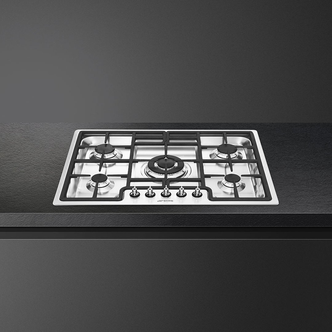SMEG Classica 75 cm gas cooktop built into a dark kitchen countertop