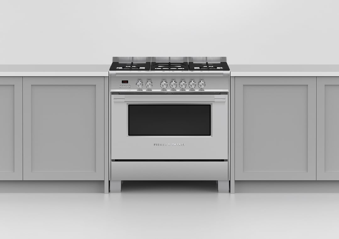 A stainless steel dual fuel cooker installed in a modern kitchen setting