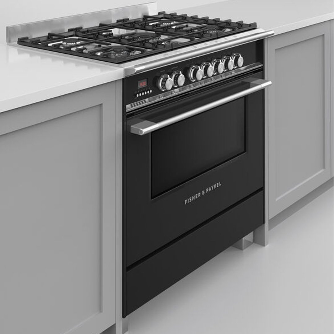 Black dual fuel cooker with five burners built into a kitchen counter