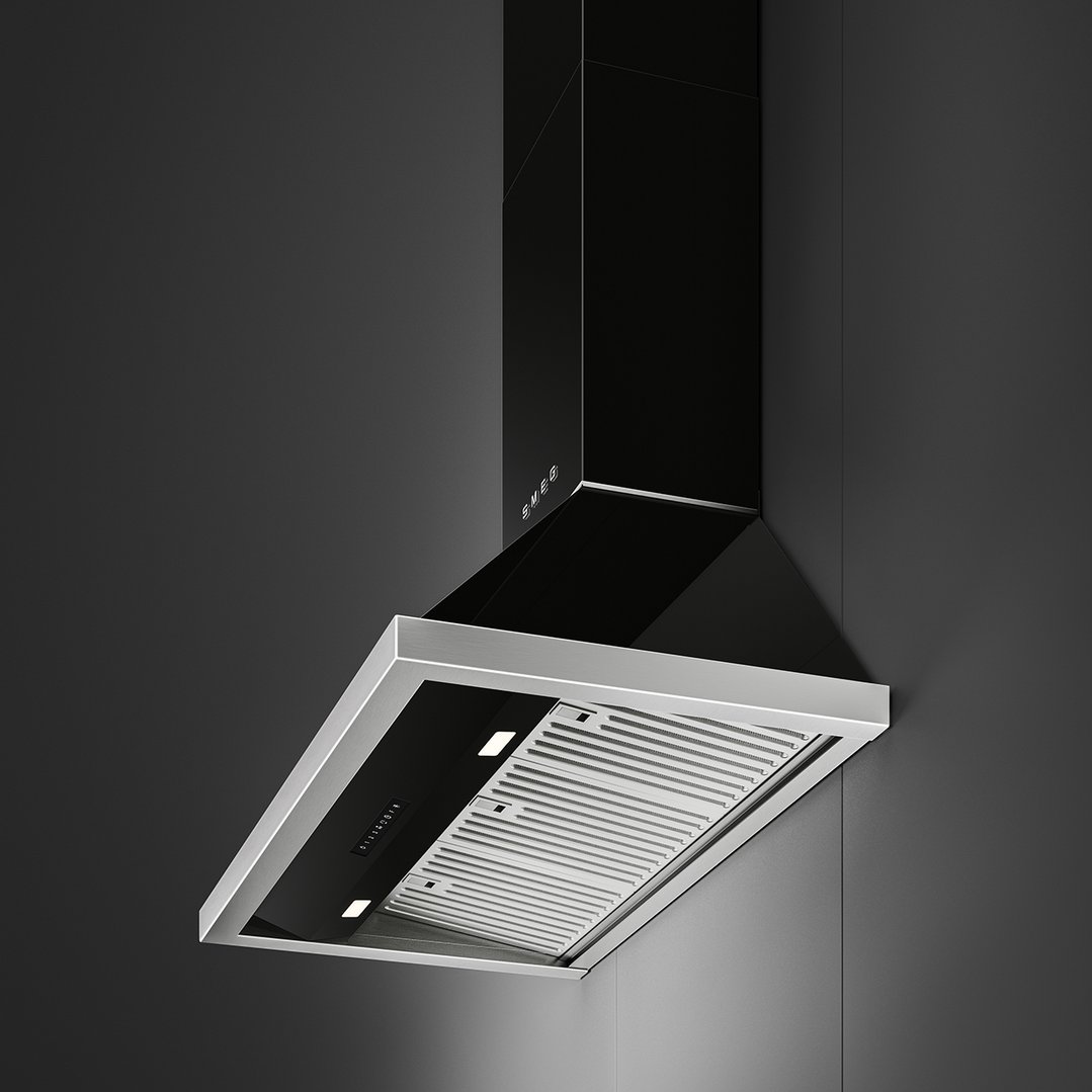 Black Smeg canopy rangehood with stainless steel trim mounted on a dark wall