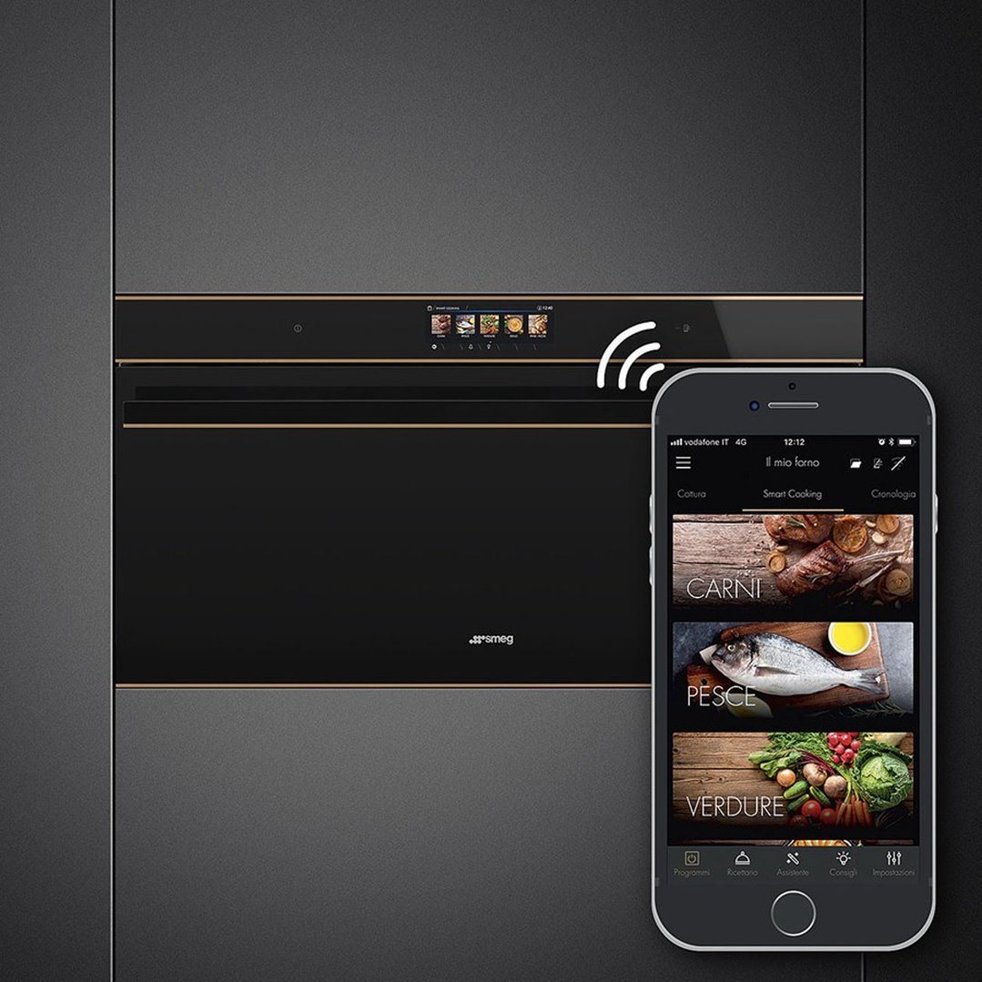 Black built-in oven with gold trim, controlled by a smartphone app