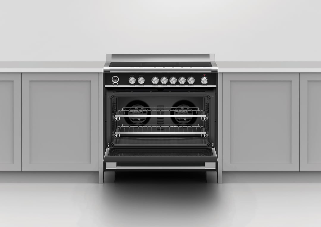 Black oven with open door and racks in a kitchen setting
