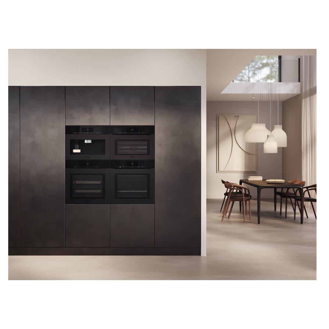 Built-in matte black speed oven and microwave combination in a modern kitchen setting