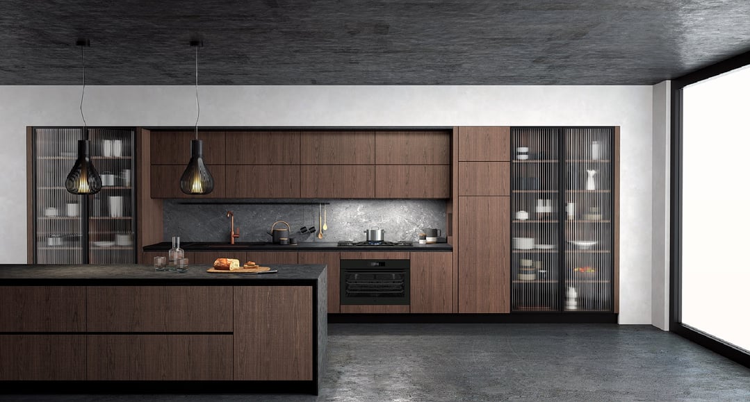 Built-in oven in a modern kitchen with dark wood cabinets and concrete finishes