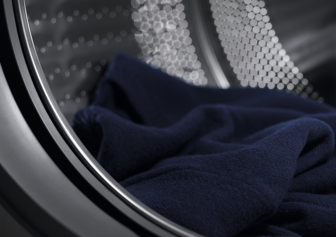Close up of dark blue fabric inside a washer dryer combo drum