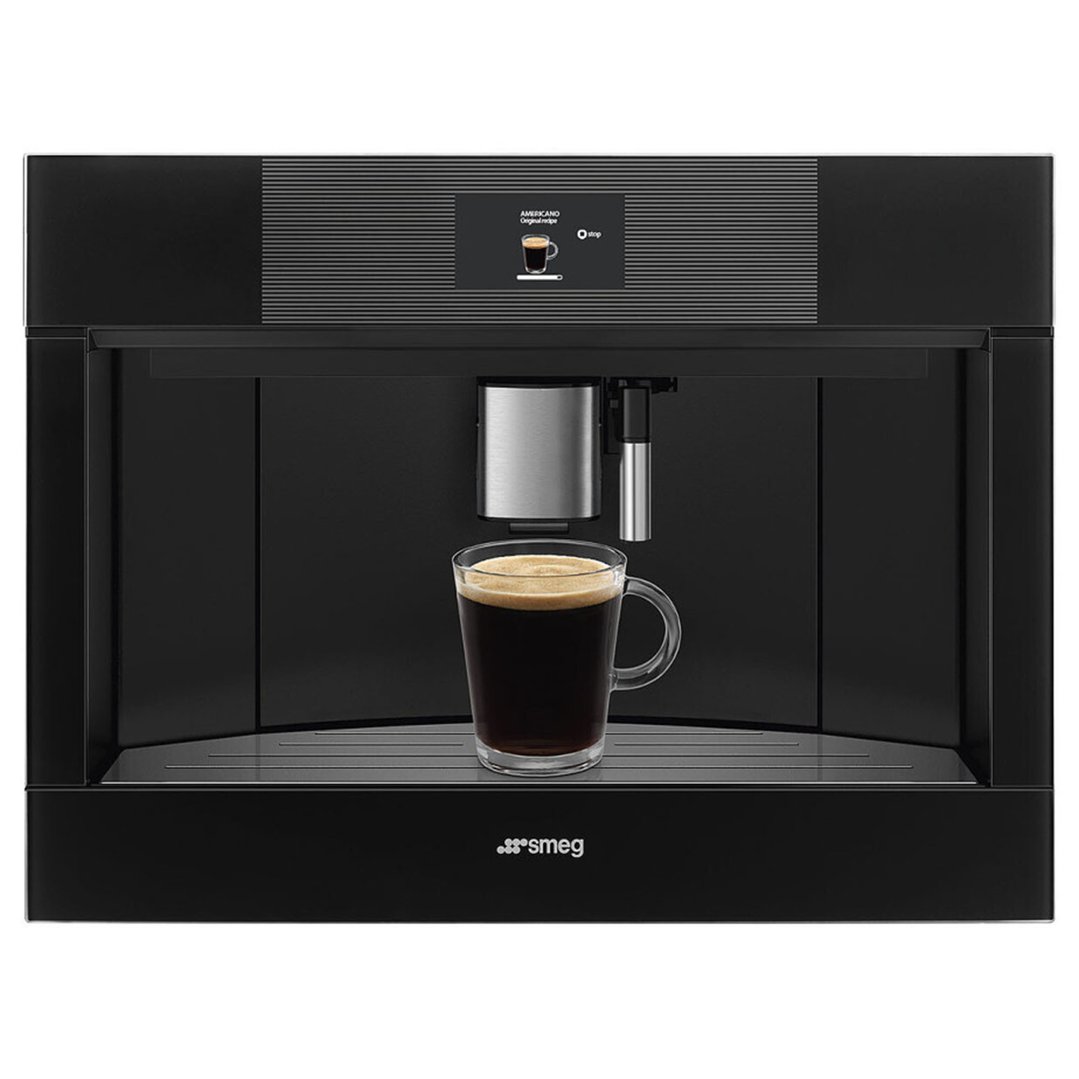 Black built-in coffee machine dispensing coffee into a clear glass mug