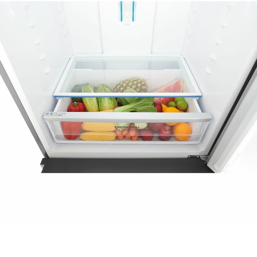 Open refrigerator interior with fresh fruits and vegetables in crisper drawers