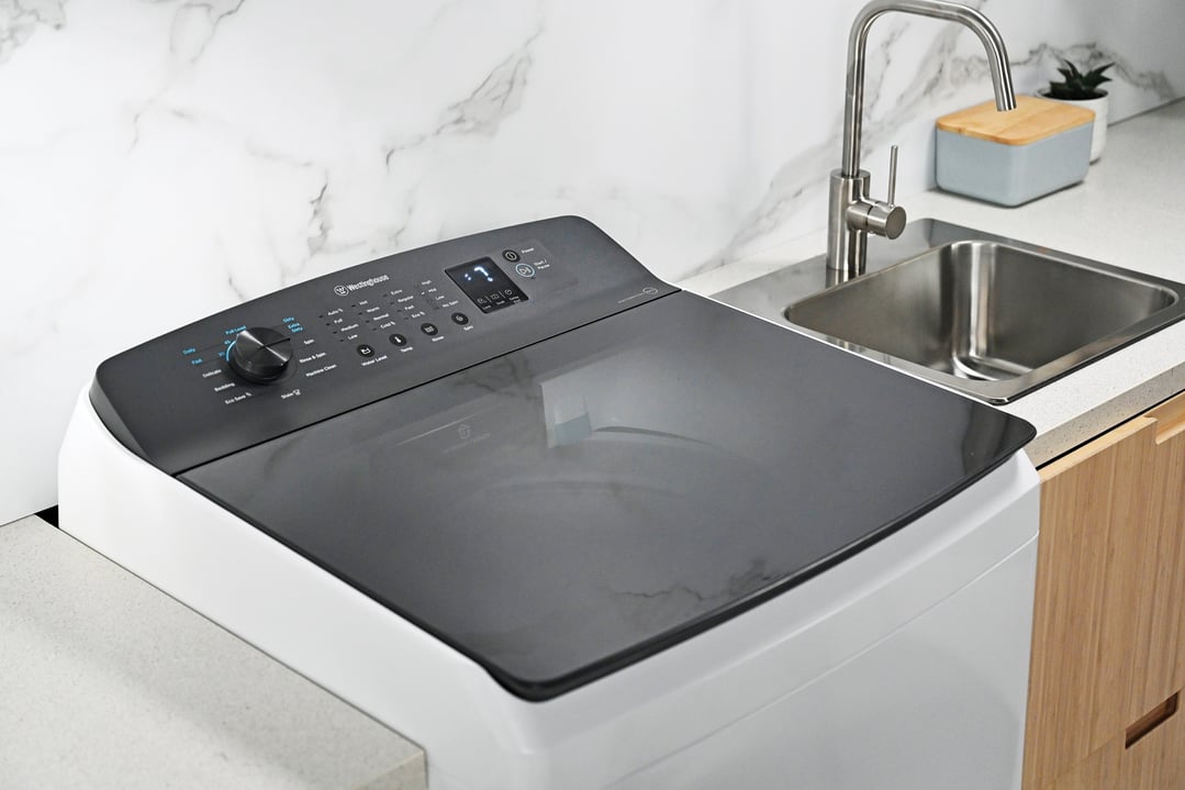 Westinghouse 10kg top load washing machine in a modern laundry setting