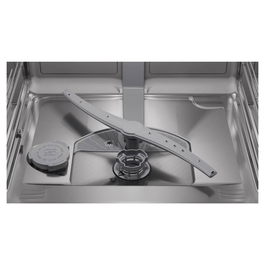 Close-up of the interior of a dishwasher, showing the spray arm and filter