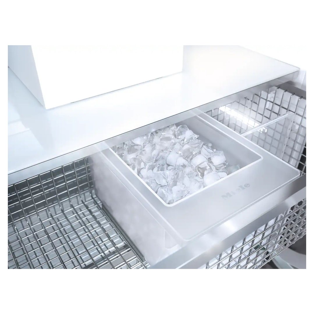 Close up of a freezer's ice maker drawer filled with ice cubes