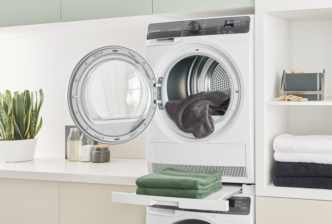 A Westinghouse 8kg EasyCare 500 Series Heat Pump Dryer with its door open