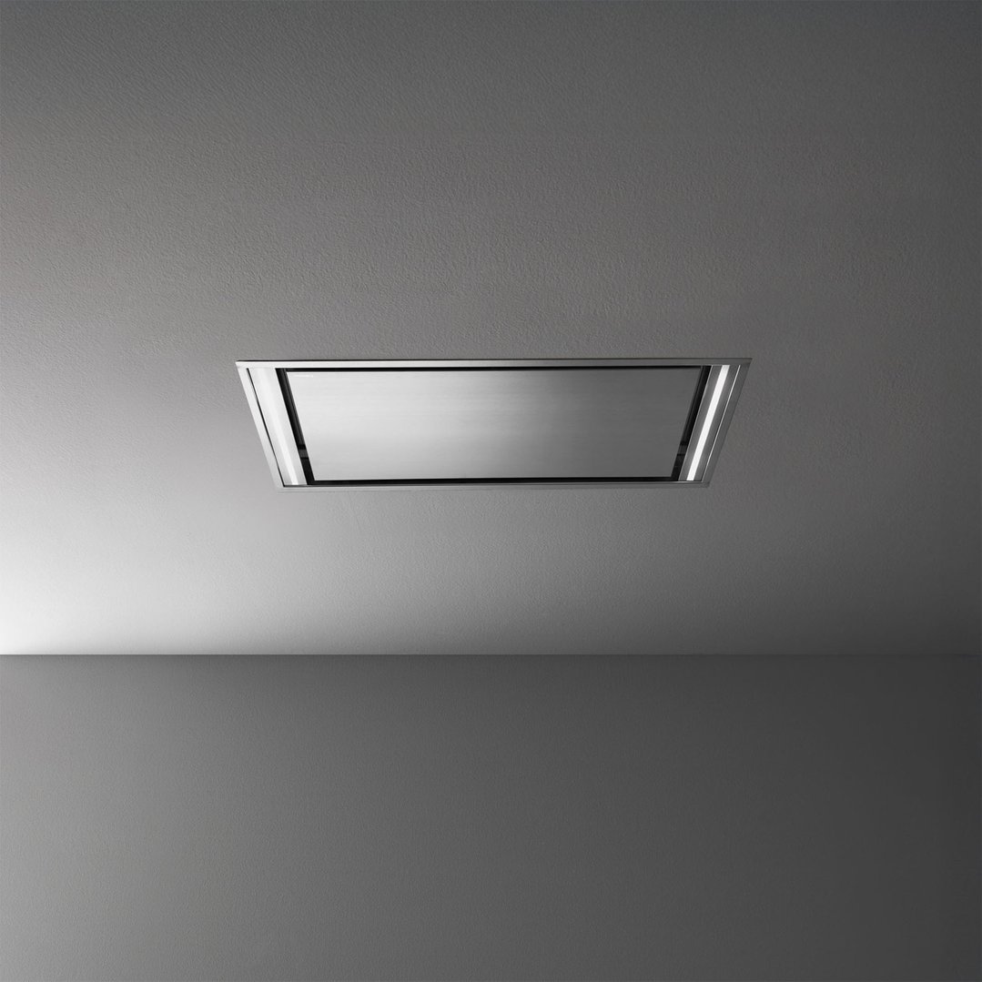 Stainless steel rangehood integrated into a light grey ceiling