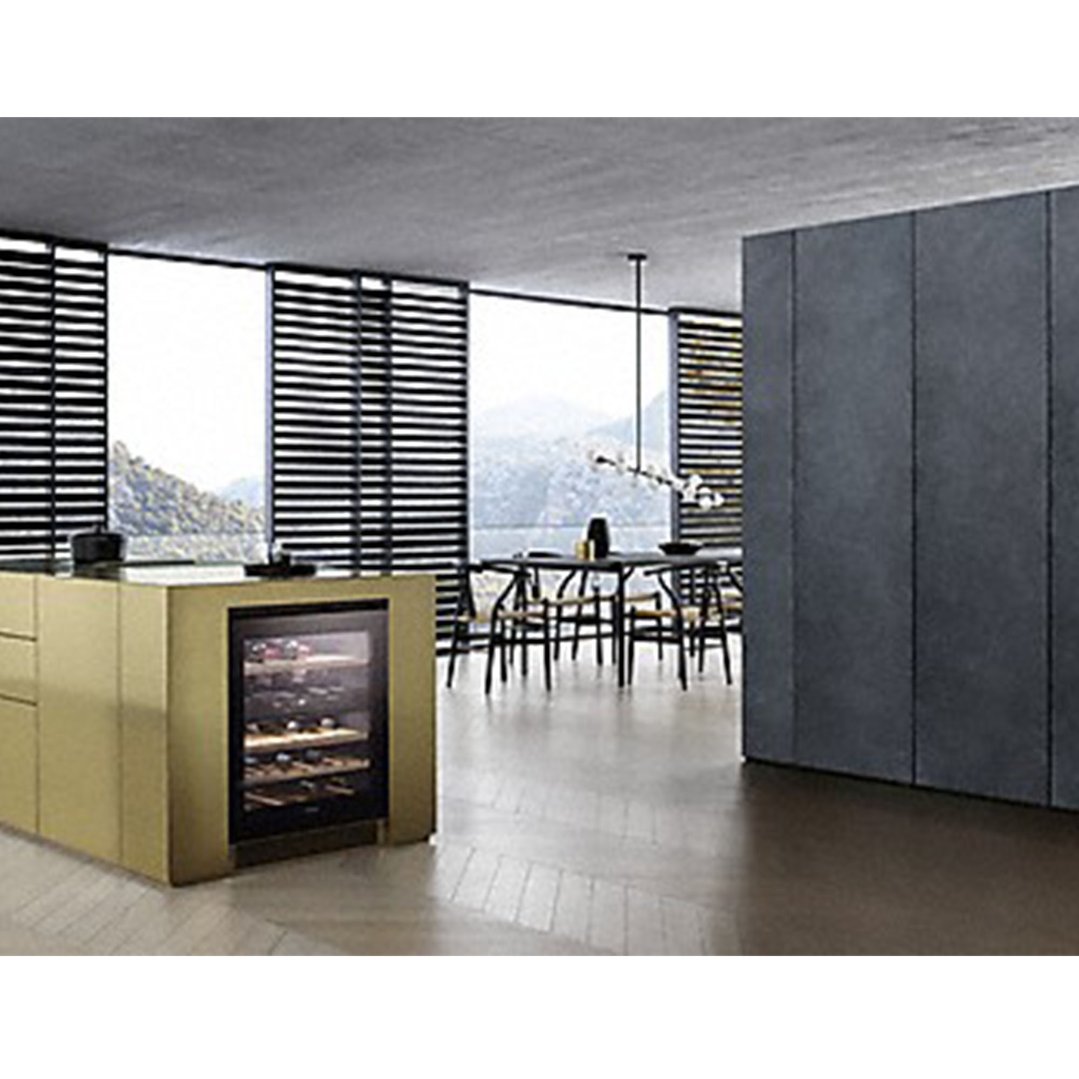 Built-under wine conditioning unit in a modern kitchen island with dining area