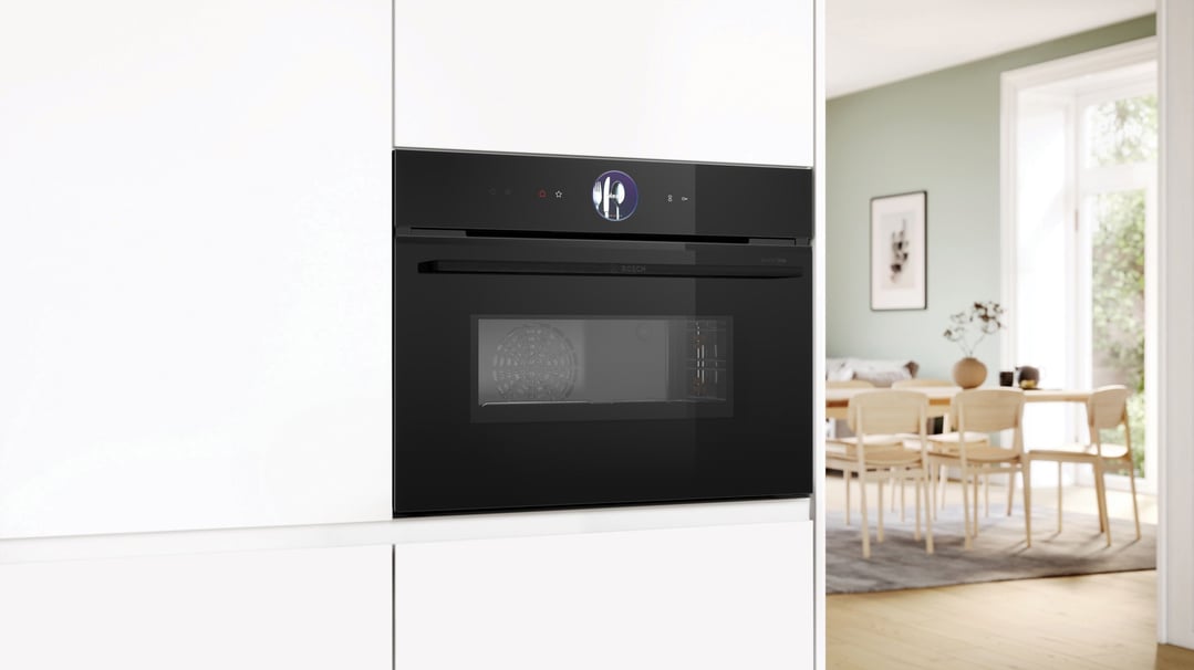 Built-in compact combination oven with microwave in a modern kitchen setting