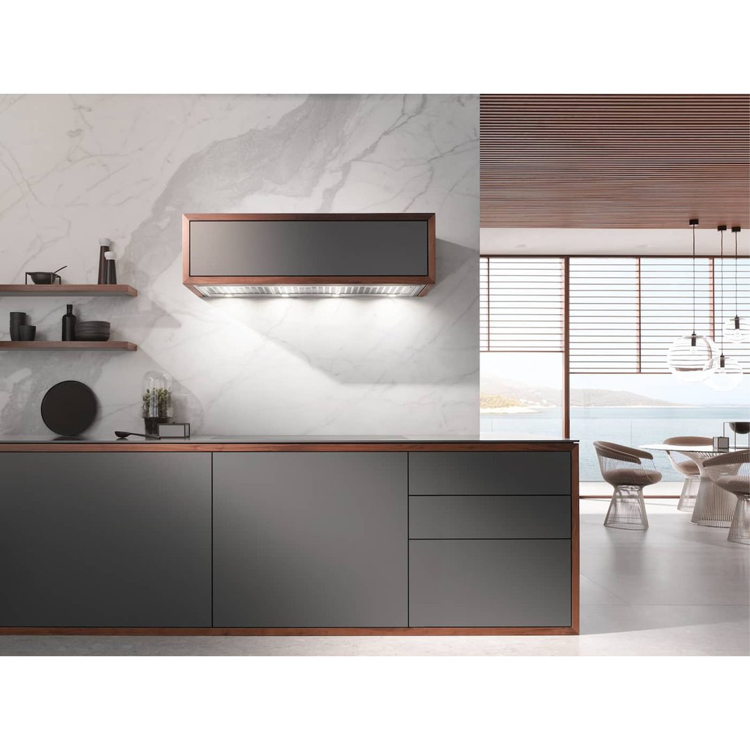 Built-in rangehood with lights above a kitchen counter in a modern kitchen
