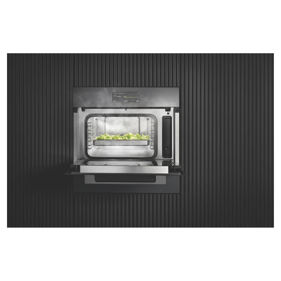 Steam and microwave combination oven with door open, food inside, built into a dark wall