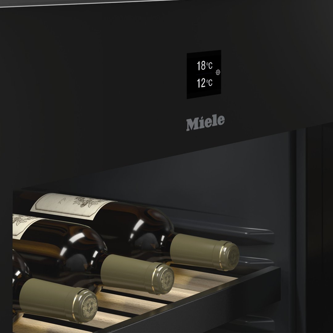 Close up of a wine conditioning unit with bottles and temperature display