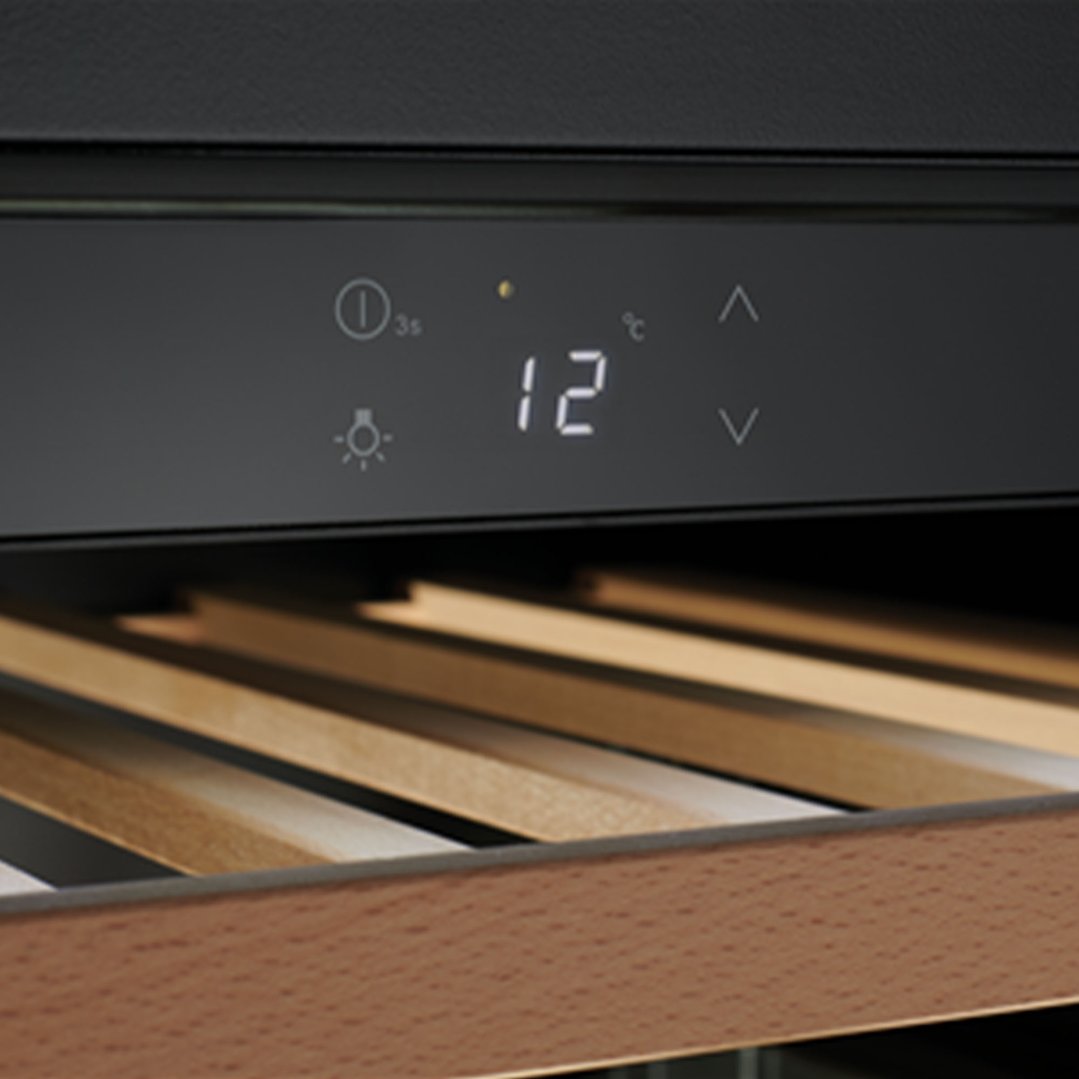 Close up of a wine cabinet's control panel and wooden shelves
