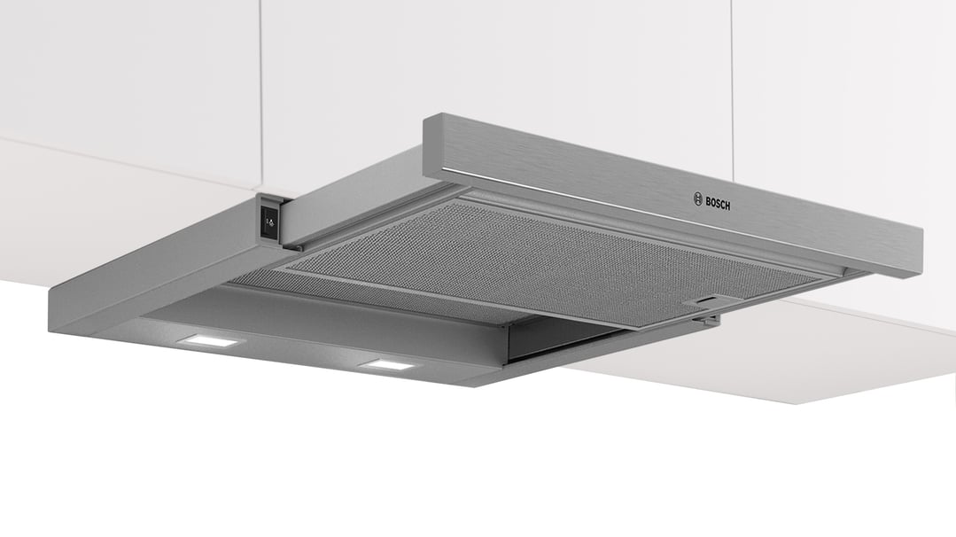 Silver metallic Bosch slideout rangehood installed under white kitchen cabinets