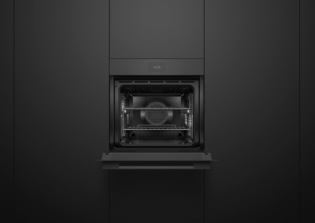 Black built-in oven with door open, showing interior racks and controls