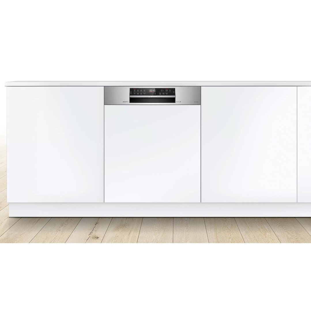A semi-integrated Bosch dishwasher built into white kitchen cabinetry