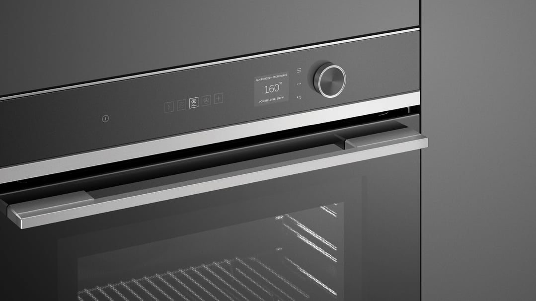 Close up of a built-in compact combi-microwave oven with its display on