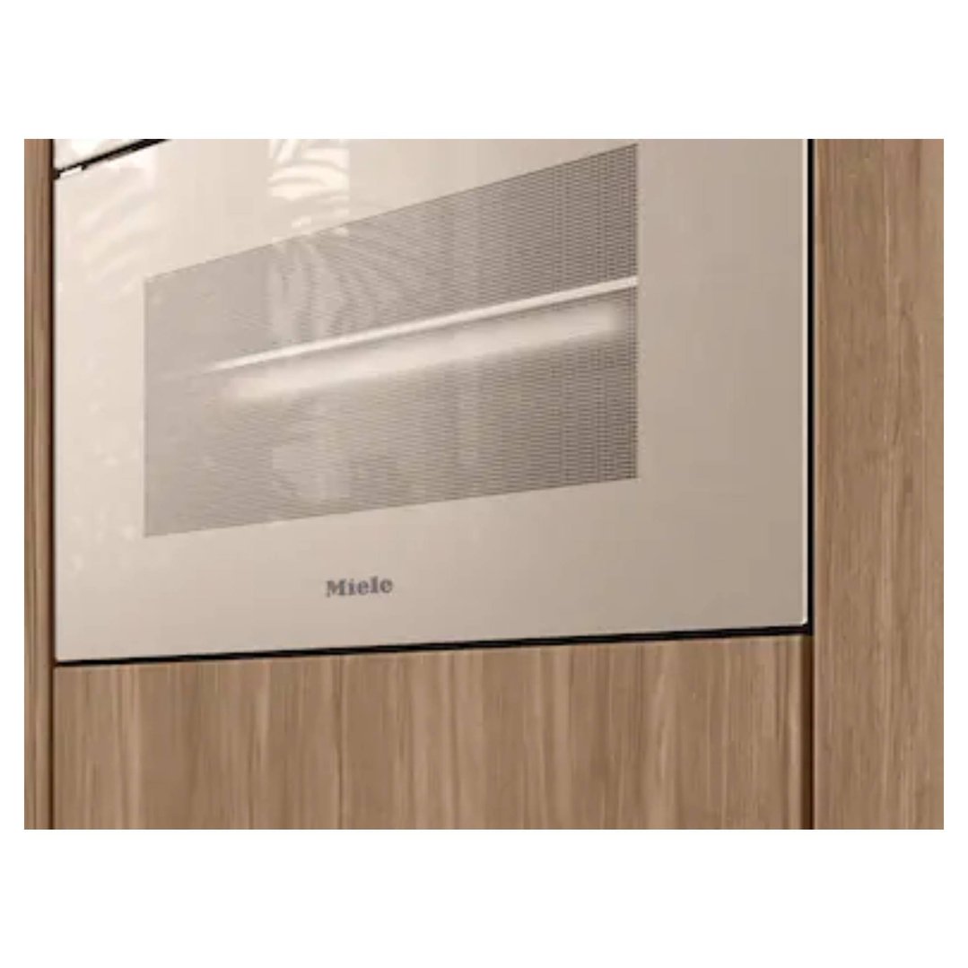 Built-in Miele combination steam oven in pearl beige, integrated into wooden cabinetry